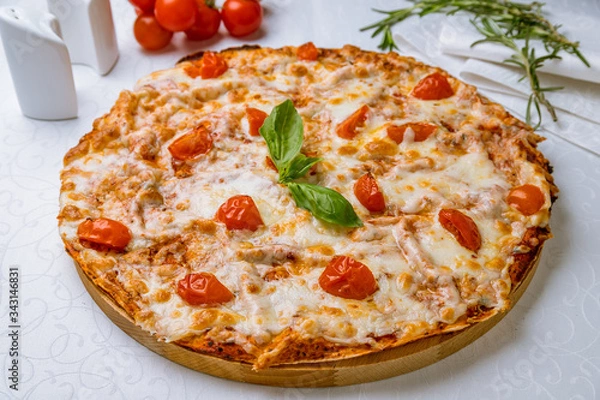 Obraz Italian pizza Margherita with tomatoes and basil on white table