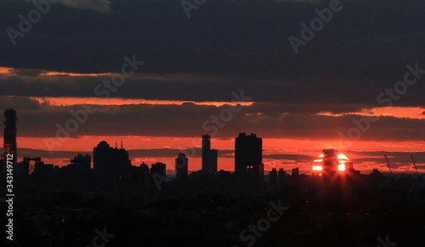 Fototapeta A beautiful, dramatic sunset over NYC