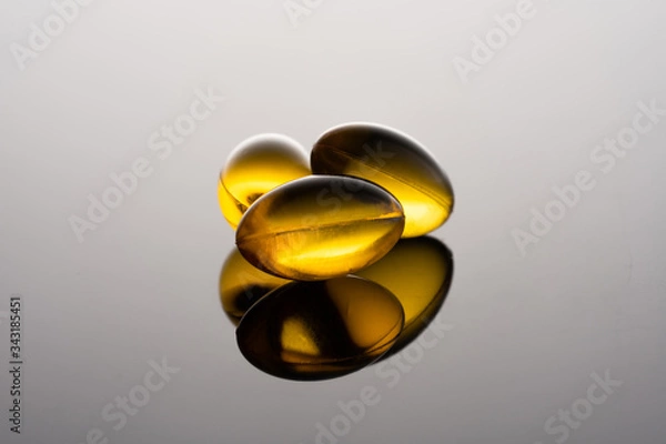 Fototapeta Fish oil (omega 3) cabsules on black background