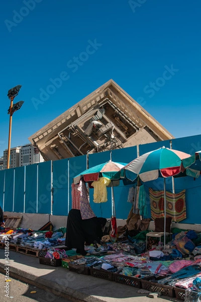 Obraz Collapsed Building with street seller as foreground