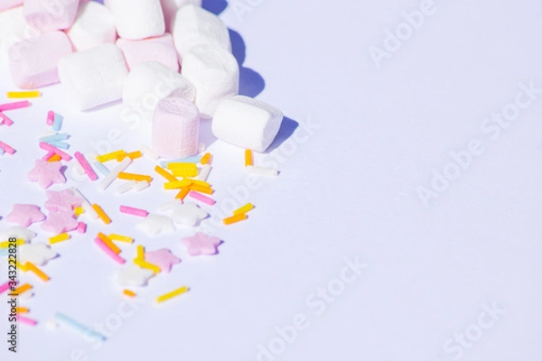 Obraz Sugar colorful sprinkles, stars and marshmallows, baking decorations in multicolor, bright picture, home made bakery White background with copy text space