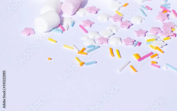 Obraz Sugar colorful sprinkles, stars and marshmallows, baking decorations in multicolor, bright picture, home made bakery White background with copy text space