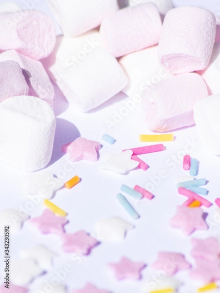 Obraz Sugar colorful sprinkles, stars and marshmallows, baking decorations in multicolor, bright picture, home made bakery, White background and heavy shade