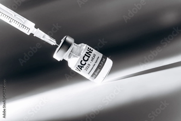 Fototapeta Coronavirus vaccine in his hand, Vaccine and syringe injection It use for prevention.