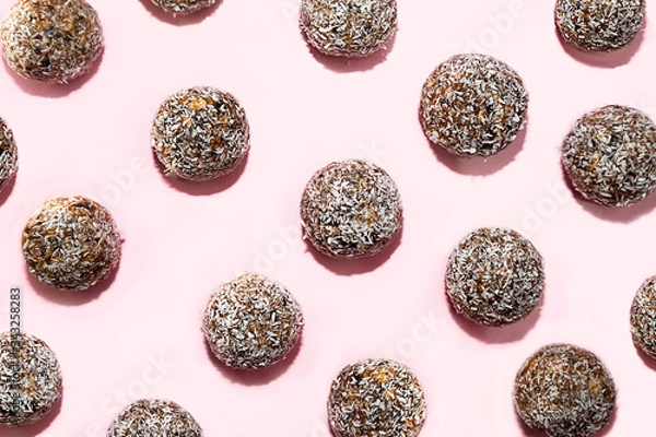 Fototapeta Pattern made of energy balls with oat and coconut.