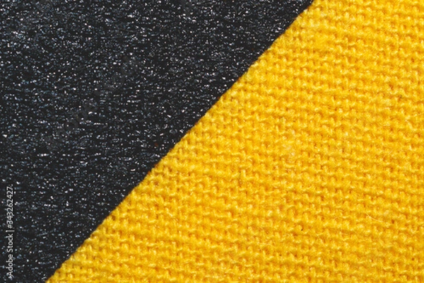 Fototapeta Black and yellow fabric texture. knitted textile close up. woven background