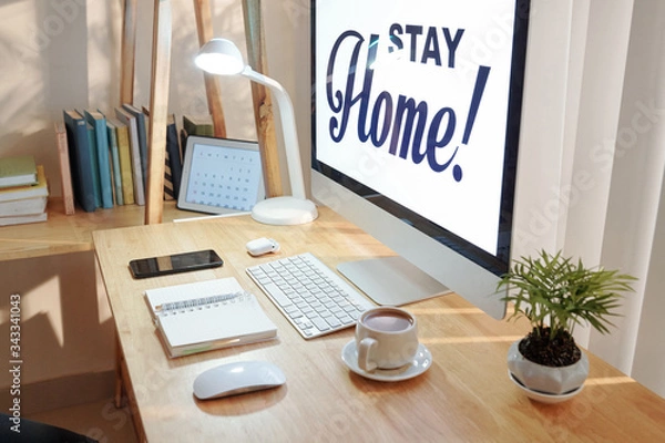 Fototapeta Stay home inscription on screen of computer of person working from home during pandemic