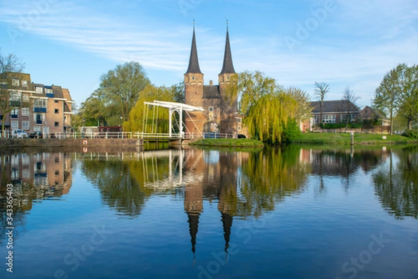 Fototapeta A view from the canal of the Oostpoort (east gate) in the city of Delft.