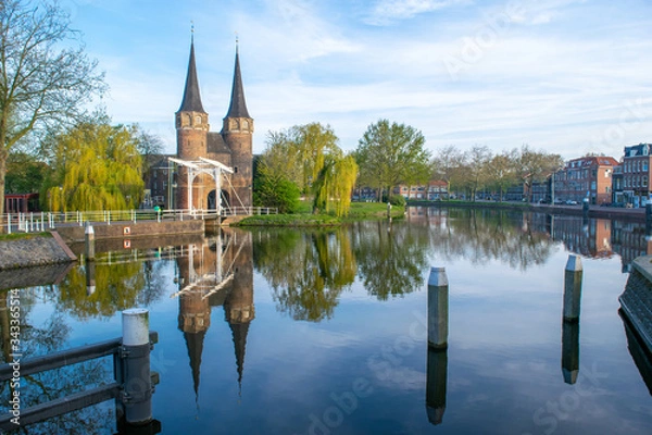 Fototapeta A view from the canal of the Oostpoort (east gate) in the city of Delft.