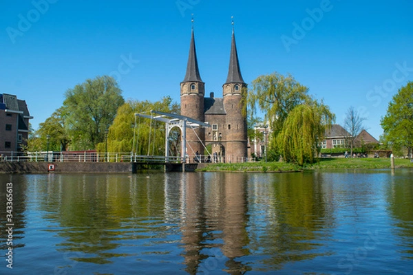 Fototapeta A view from the canal of the Oostpoort (east gate) in the city of Delft.