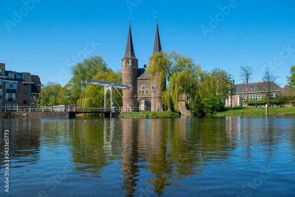 Fototapeta A view from the canal of the Oostpoort (east gate) in the city of Delft.