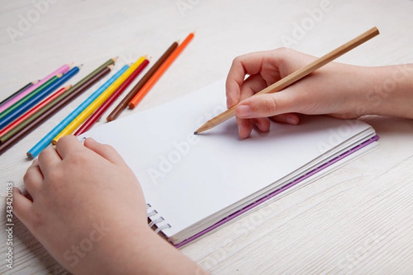 Obraz Children's hands draw with crayons