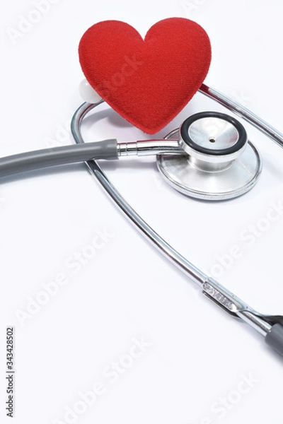 Fototapeta Red heart with stethoscope isolated on white background