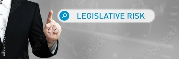 Fototapeta Legislative Risk. Man in a suit points a finger at a search box. The word Legislative Risk is in the search. Symbol for business, finance, statistics, analysis, economy
