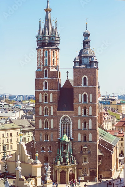 Fototapeta Beautiful view on Krakow famous landmark - St. Mary's Basilica (Mariacki Gothic Church)and Old Town of Krakow, made from the viewpoint on Town Hall. Travel concept
