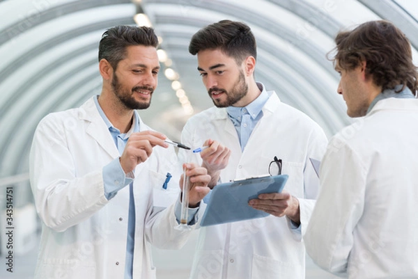 Fototapeta 3 engineer men looking at clipboard