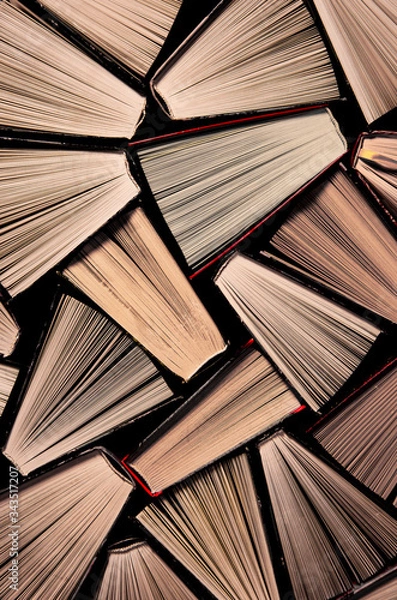 Fototapeta Many old books in a book shop or library. Shallow DOF
