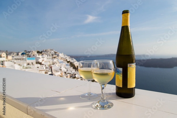 Fototapeta white wine on the balcony in Santorini