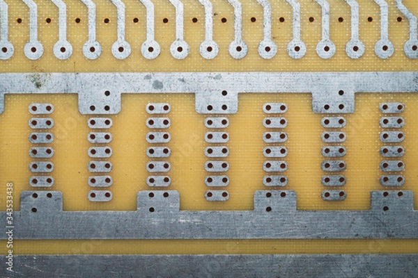 Fototapeta Printed circuit board without elements. perforated textolite surface. template for soldering the circuit