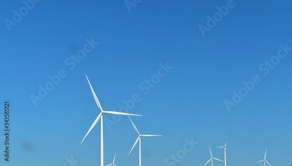 Obraz wind turbine on blue sky