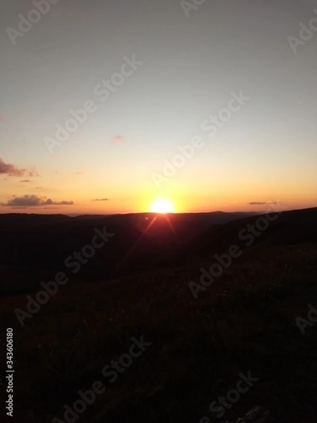 Fototapeta sunset in the mountains