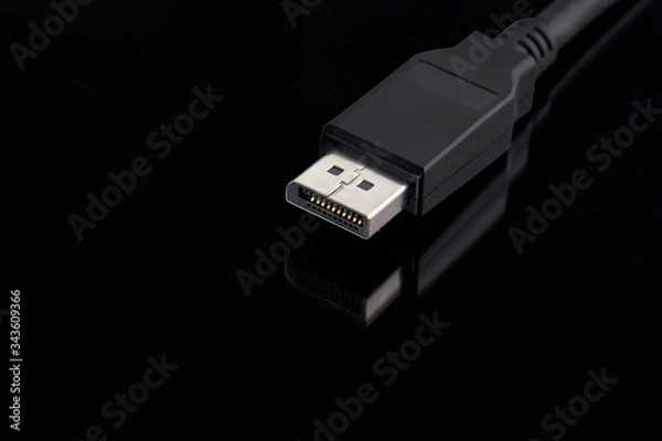 Fototapeta display port cable plug close up over black background. desktop gaming and tv concept.