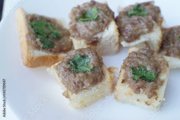 Fototapeta Home-made food Airfryer bread with minced pork spread. 