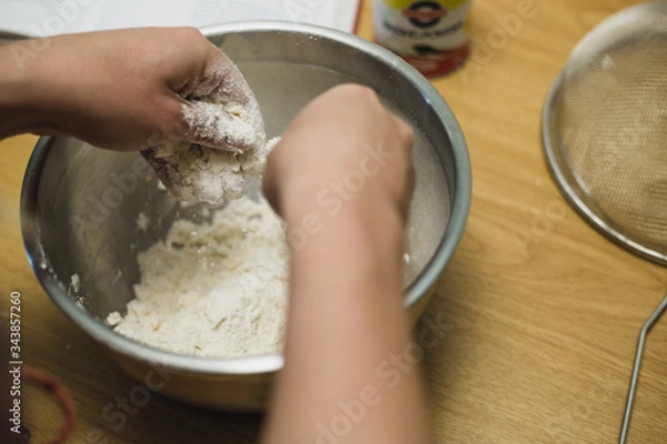 Fototapeta Making dough by hand