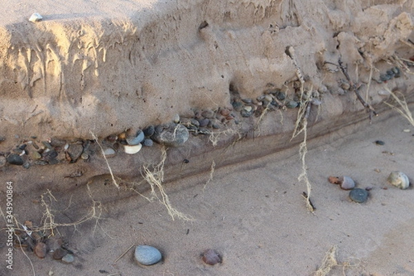 Obraz Pebbles in the sand layers