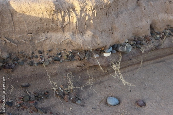 Obraz Pebbles in the sand layers