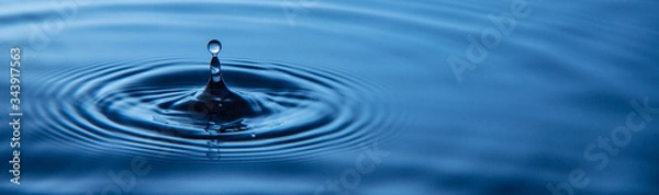 Fototapeta Water splash or water drop.Water drop in sunlight.