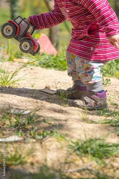 Obraz Kids on Playground playing in Sandbox with  digger
