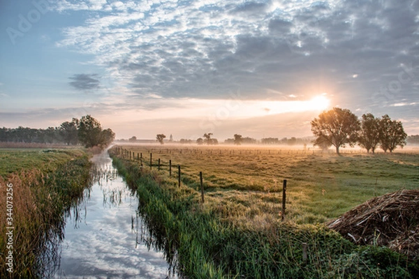 Obraz sunrise over the field