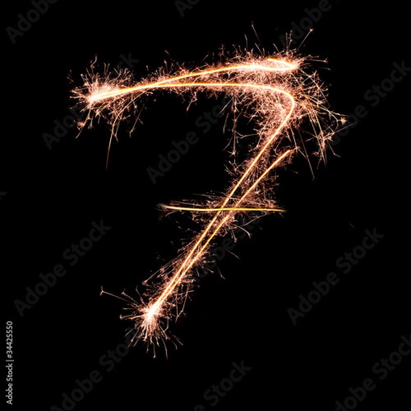 Fototapeta Digit 7 made of sparklers isolated on black