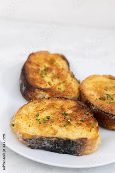 Fototapeta French toast served on the white plate with white background