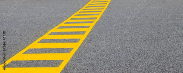 Obraz yellow lines on asphalt showing a safe crossing