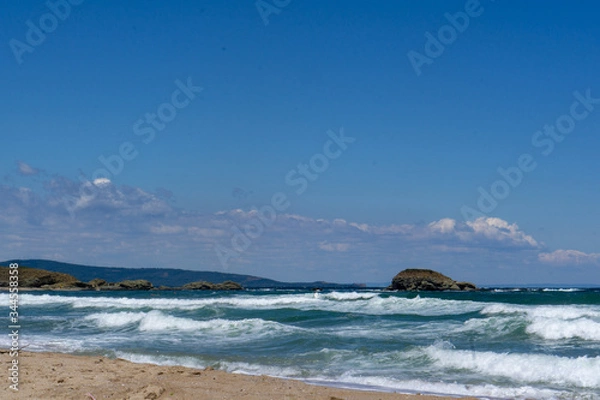 Obraz seaside waves blue white clouds background