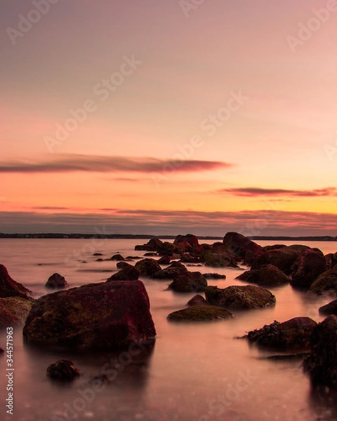 Obraz sunrise at beach with rocks