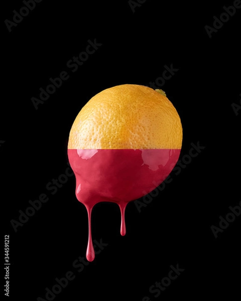 Fototapeta Lemon with paint dripping on a black background Isolated
