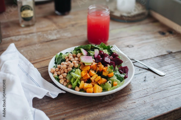 Obraz Organic salad in rustic cafe in Malibu