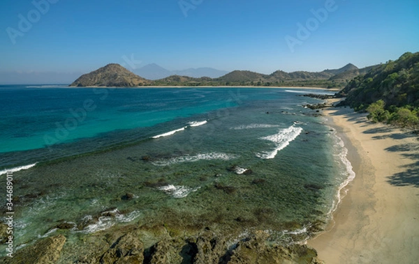 Obraz Pristine beach scene with no people or houses and Rinjani volcano in distance shot in Sumbawa Island, NTB, Indonesia