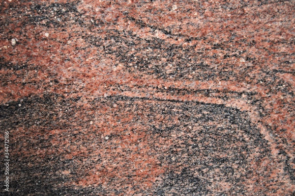 Fototapeta Image of a polished granite texture of the multicolored type of red color