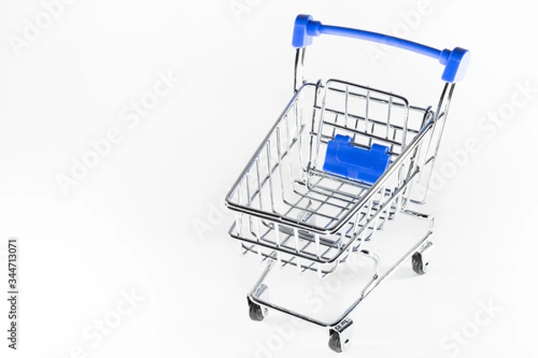 Obraz Shopping baskets on a white background. Macro shot