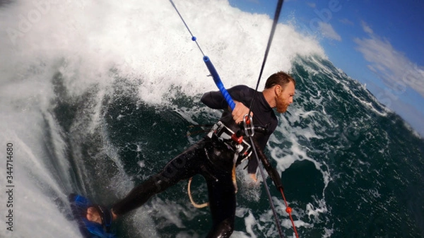 Fototapeta kitesurfer going deep into the pocket of the wave
