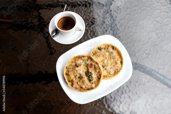 Fototapeta Bakery, chicken pie and broccoli, espresso coffee on cafe table.