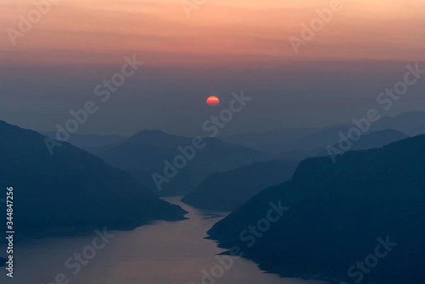 Fototapeta Landscape view of beautiful sunrise on big river and mountain view point