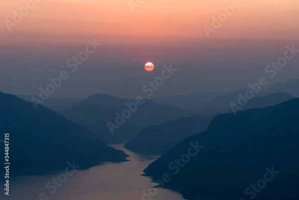 Fototapeta Landscape view of beautiful sunrise on big river and mountain view point