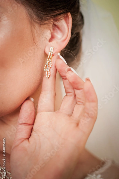 Obraz bride wearing earring on the ear