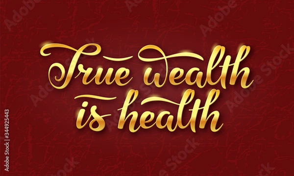 Fototapeta True wealth is health slogan. Hand drawn lettering composition  with  gold shining letters on dark burgundy  background