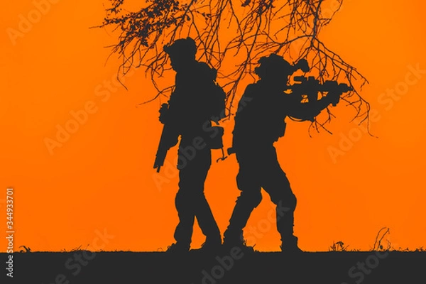 Fototapeta silhouette of Soldier.army soldier with rifle and machine gun moving .Thai army soldier in combat uniforms with machine gun.  